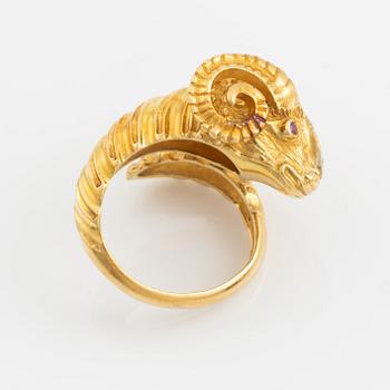 An 18K gold ram´s head ring set with round brilliant-cut diamonds and rubies.