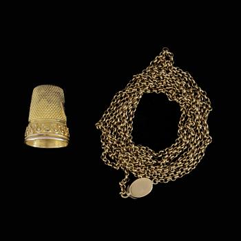 FINGEBORG OCH KEDJA, 14k och 18k guld. Vikt 15,3 gram.