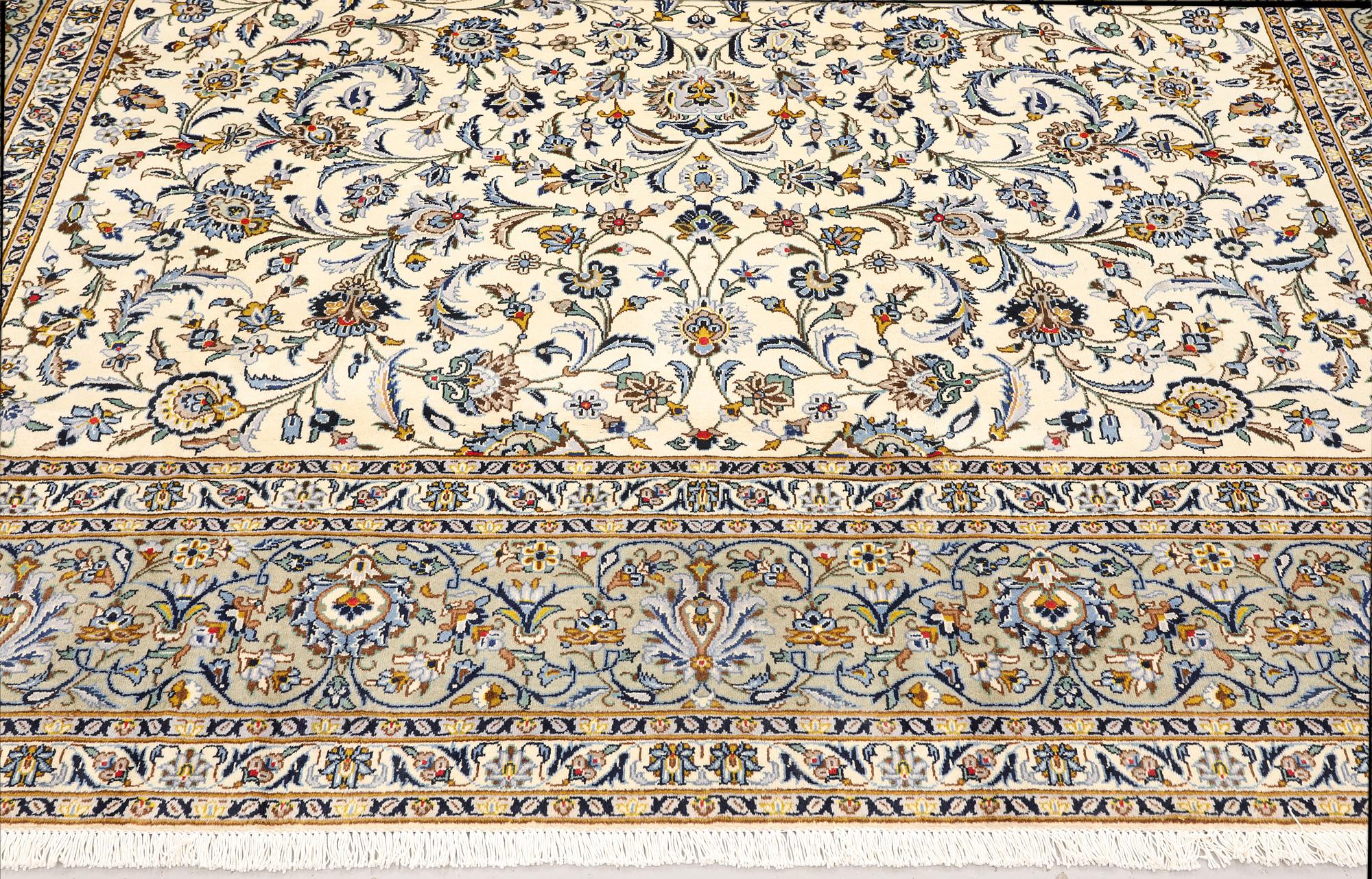 A Keshan carpet, signed, approx. 390 x 282 cm.