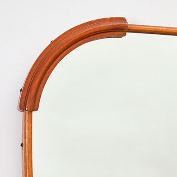 A 1940s Swedish Modern mirror.