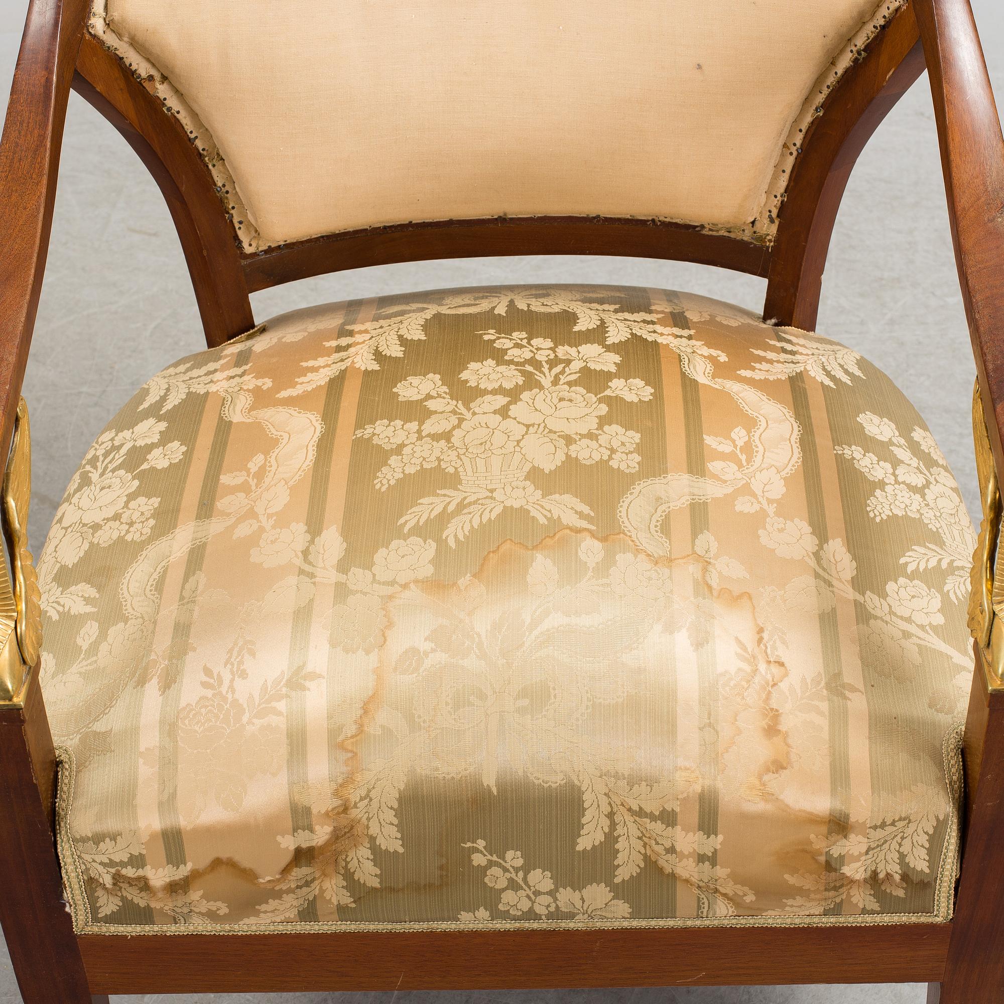 A pair of early 20th century Empire style armchairs.