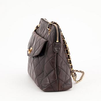 CHANEL, a quilted dark brown leather shoulder bag.