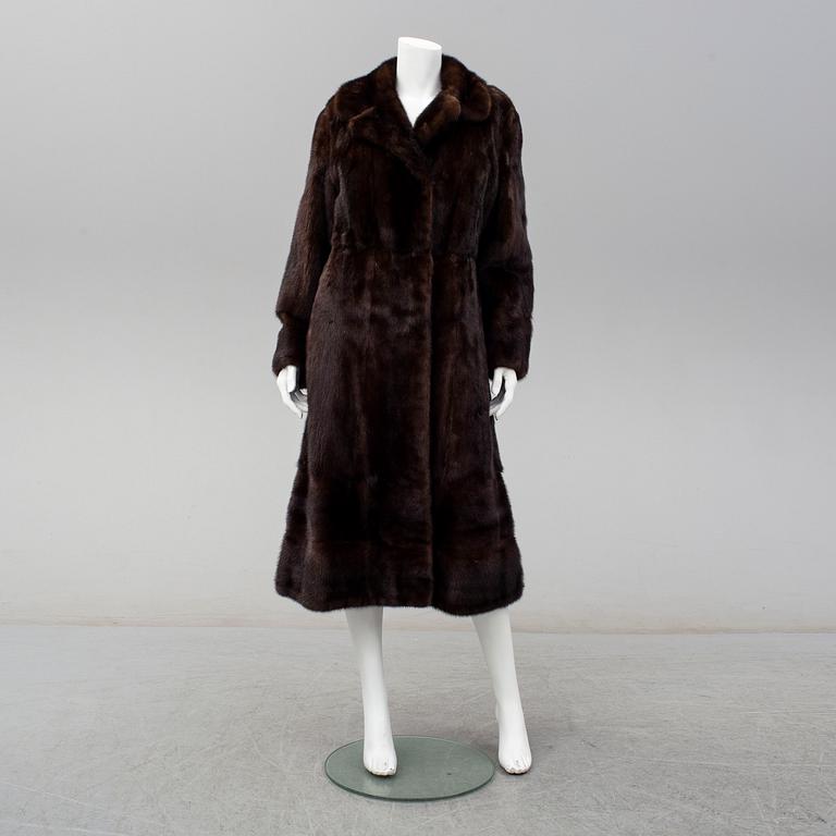 A mink coat, size M/38.