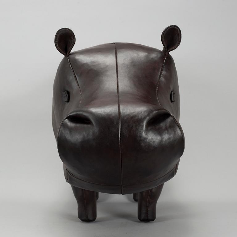 A leather footstool by Dimitri Omersa & Co.