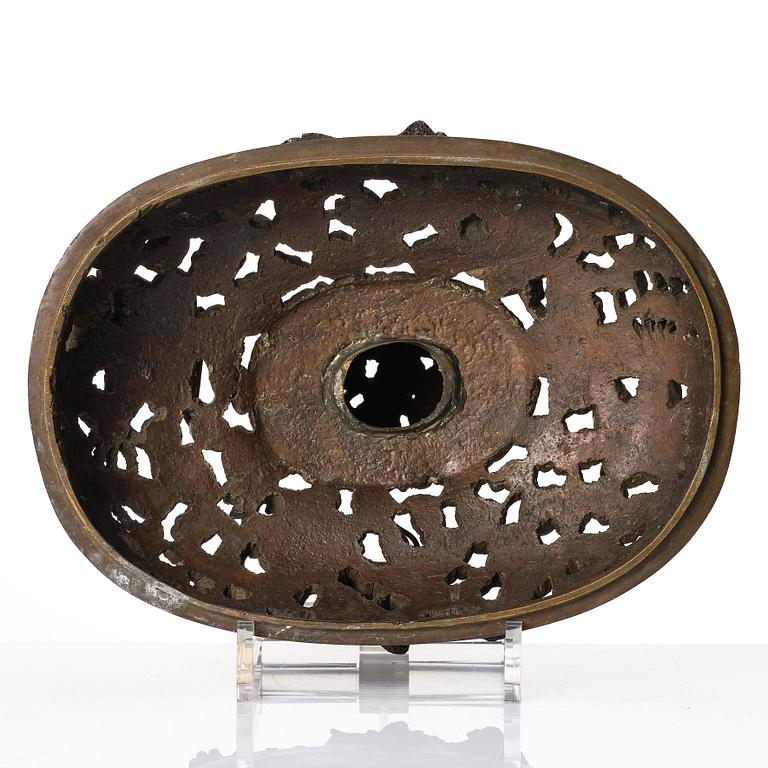 A bronze reticulated incense burner with cover, Qing dynasty (1644-1912).