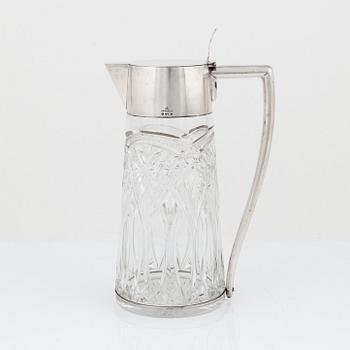 CG Hallberg, a silver and glass flagon, Stockholm 1918.
