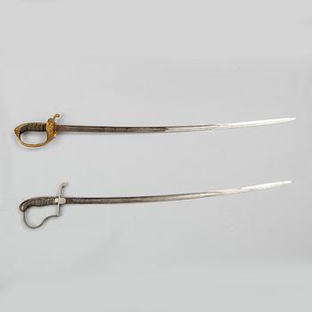 Two Swedish sabres, end of the 19th Century, with scabbards.