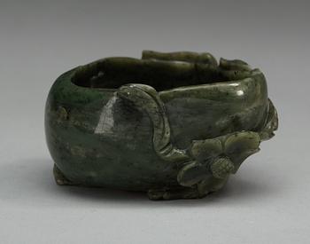 A carved nephrite brush washer, Qing dynasty.