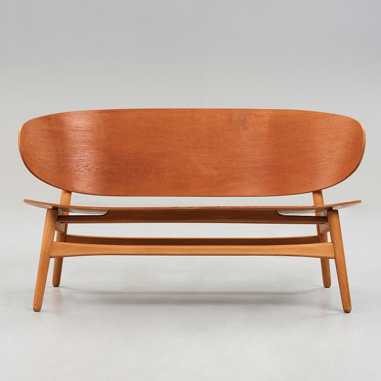 A HANS J WEGNER, a  "Shell set/ Skalsæt" comprising a sofa, a chair and a table, Fritz Hansen, Denmark 1950's.