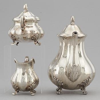 A silver coffee pot, creamer and sugar bowl, swedish import mark.