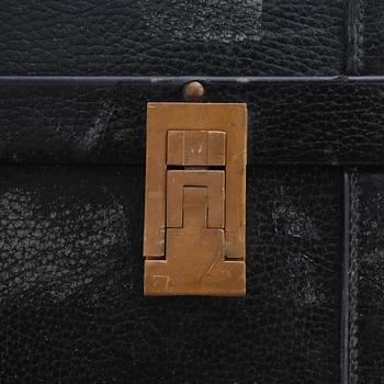 HERMÈS, a black leather suitcase from the 1950/60s.