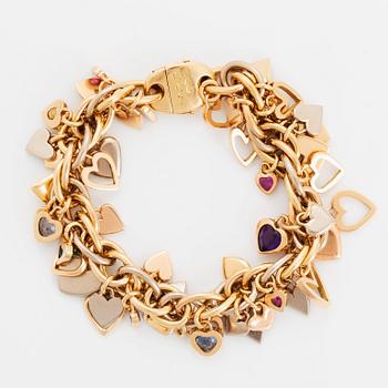 An 18K gold Gaudy bracelet with heart shaped charms.