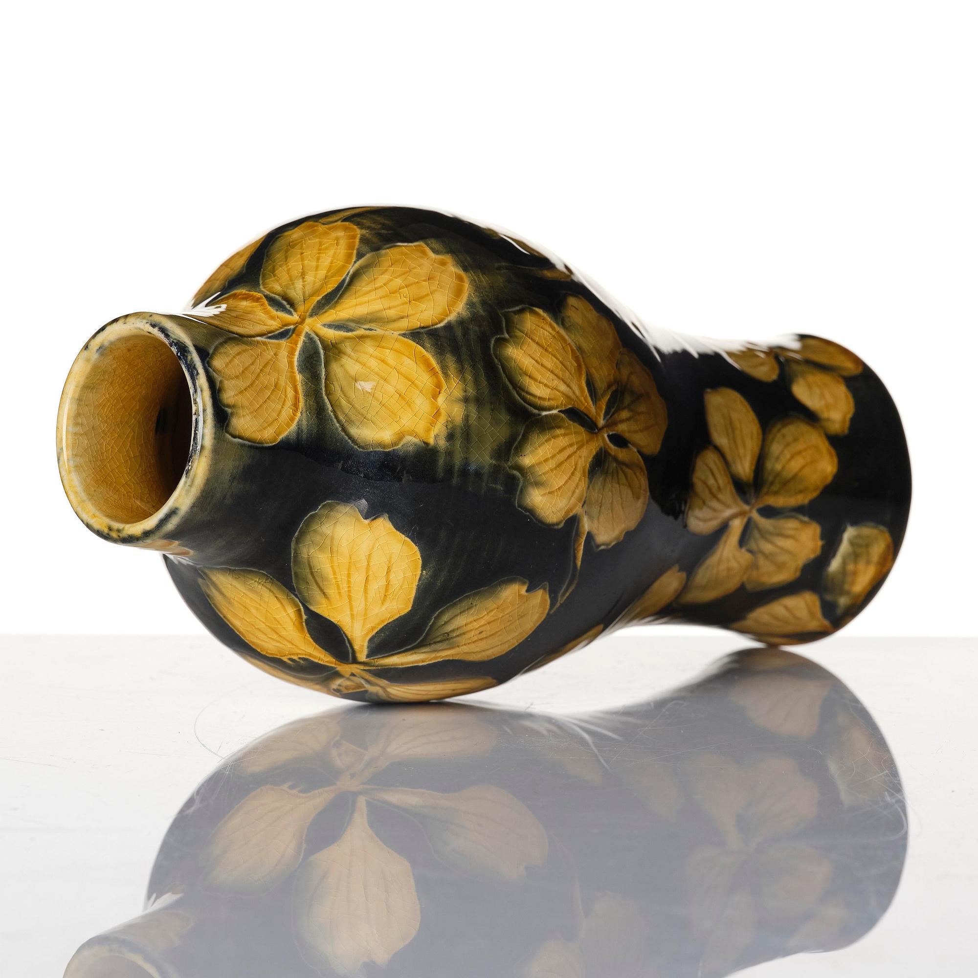 Gunnar G:son Wennerberg, an Art Nouveau glazed creamware vase, Gustavsberg, Sweden, early 20th century.