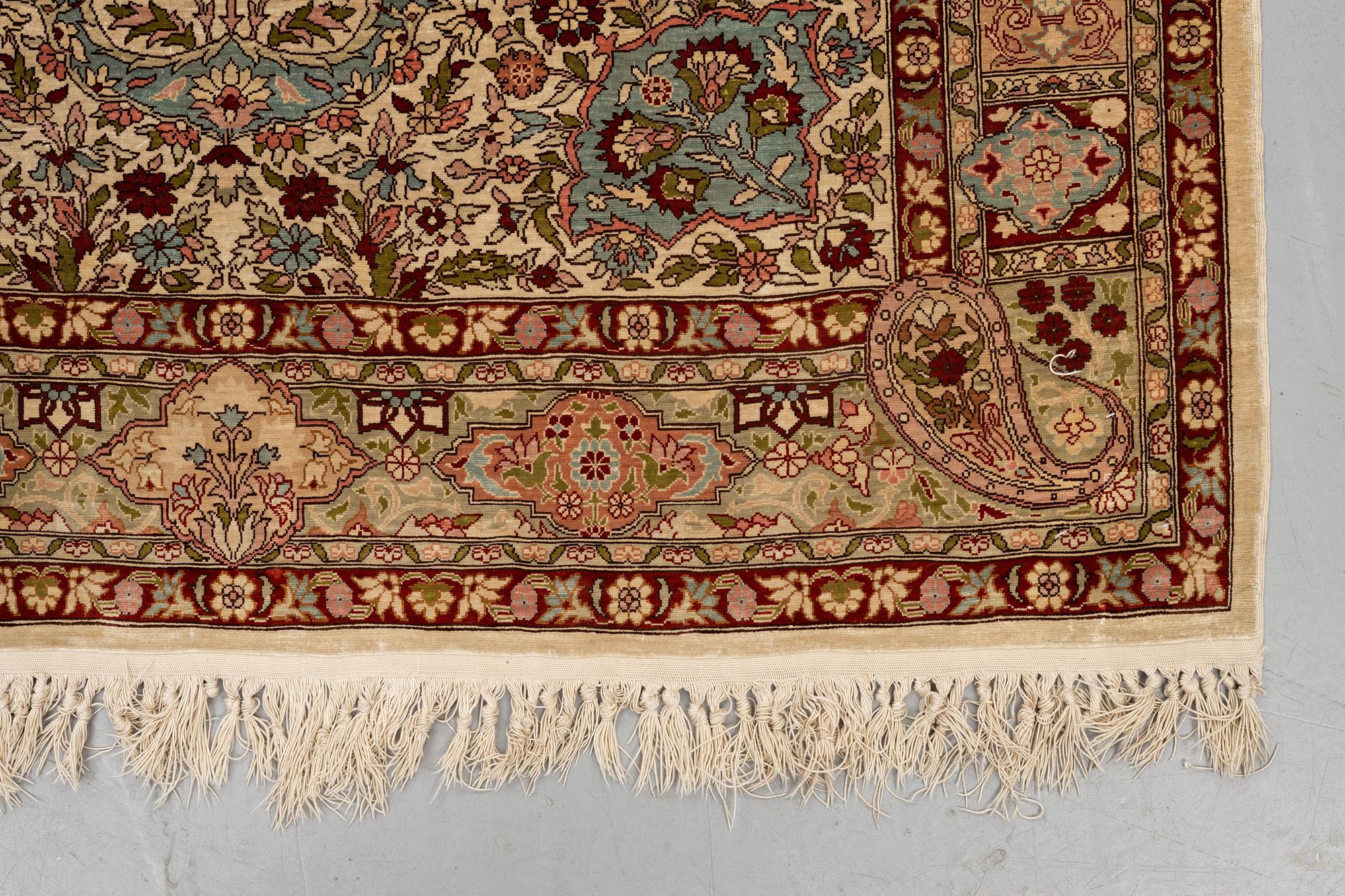 A rug, Old silk Hereke, ca 152 x 110 cm.