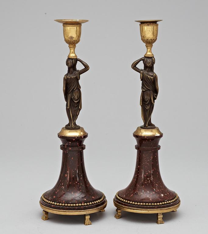 A pair of late Gustavian circa 1800 porphyry and bronze candlesticks.
