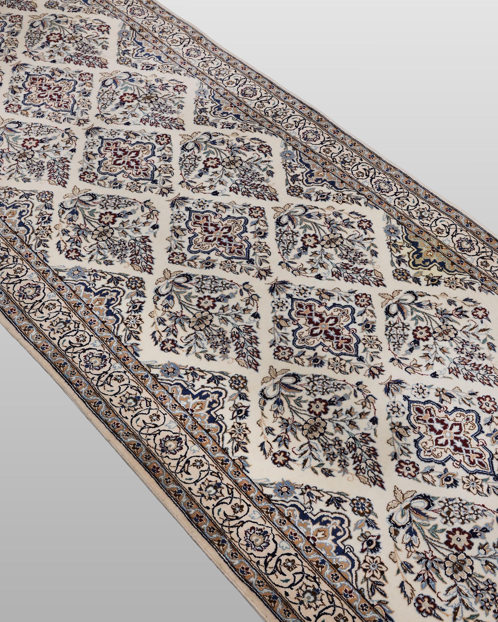 A Nain part silk carpet, 408 x 98 cm.