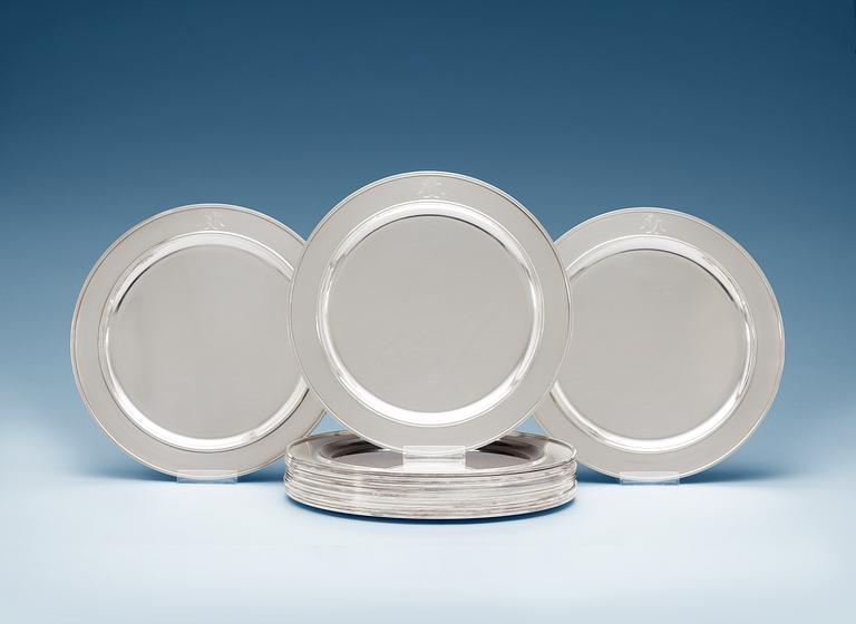 A set of sixteen Sigvard Bernadotte silver plates, Georg Jensen, Copenhagen 1945-77.