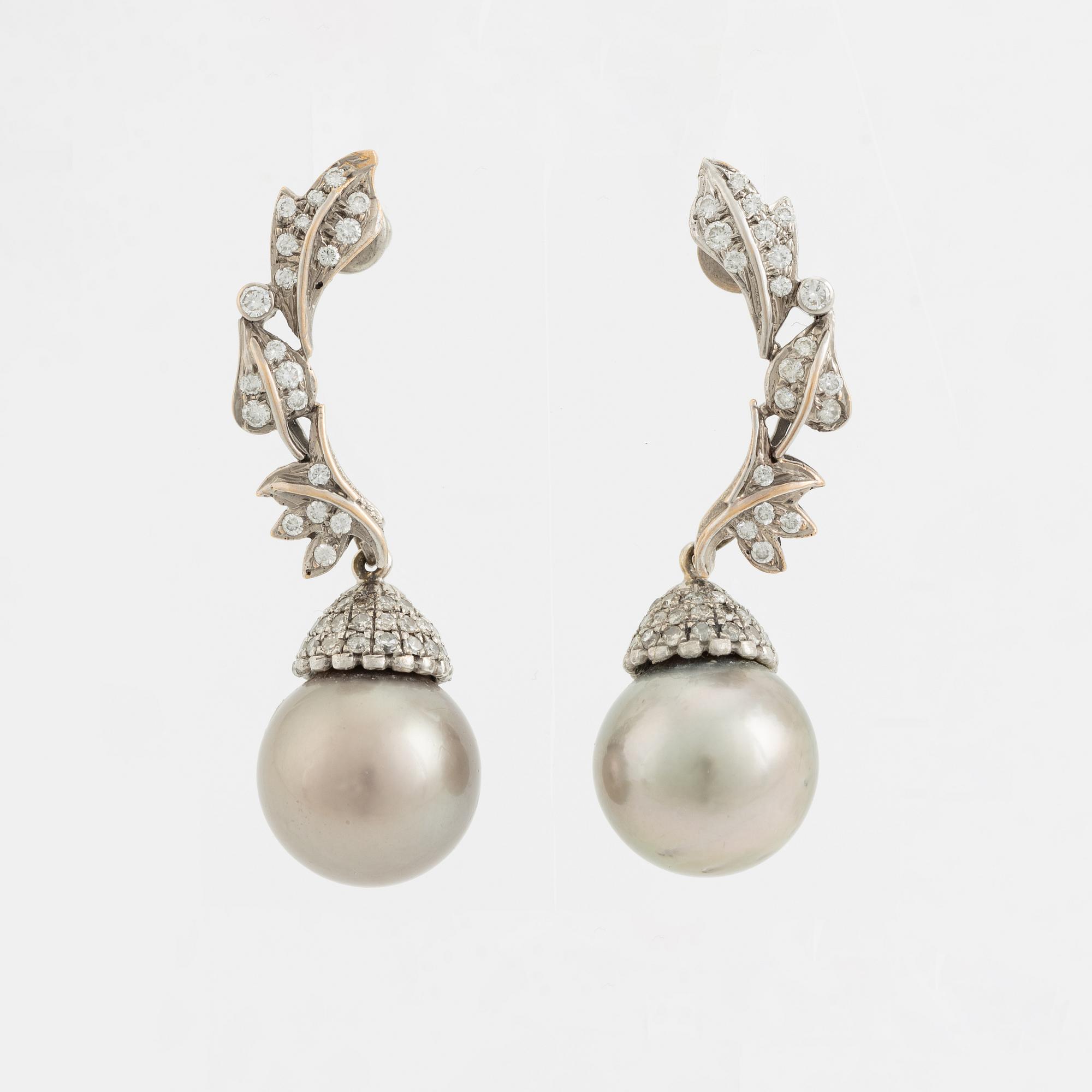 White gold, Tahiti pearl and brilliant cut diamond earrings.