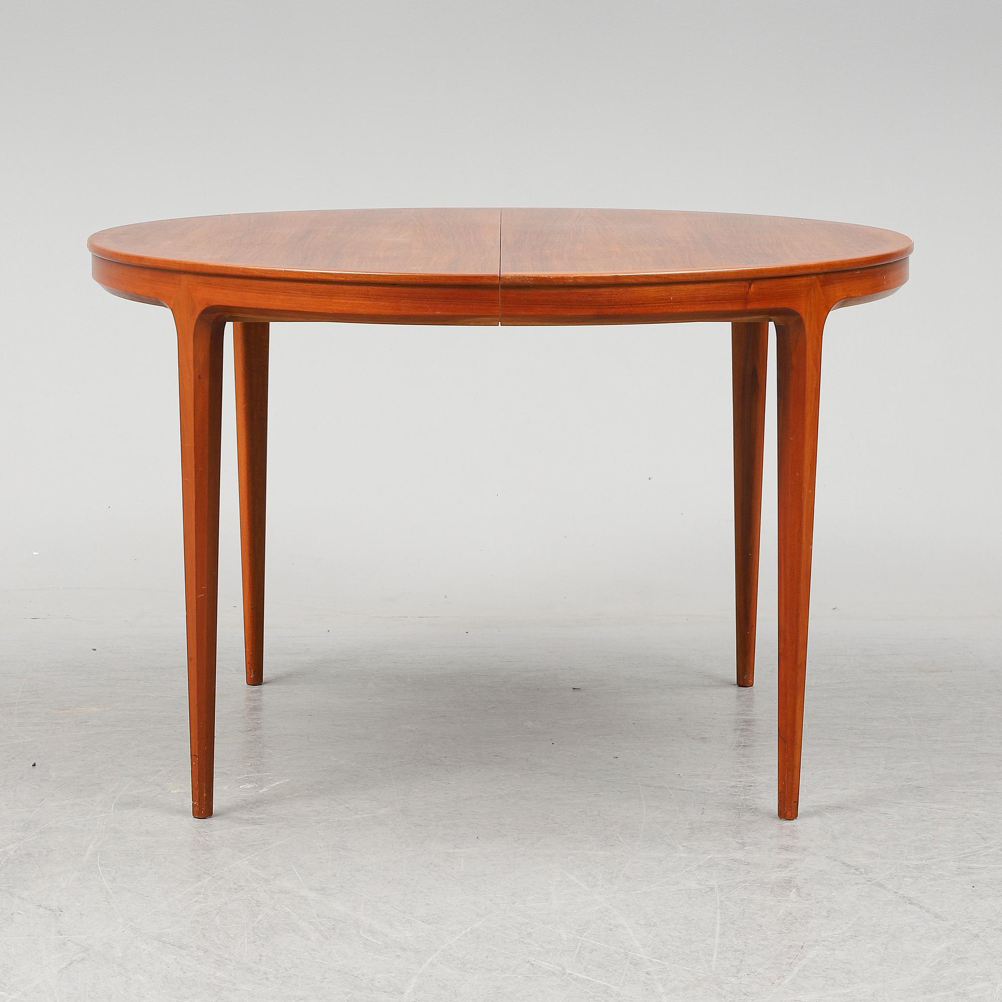 BERTIL FRIDHAGEN, a seven  piece walnut dining suite from Bodafors.