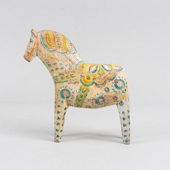 A painted Swedish wooden horse from the first half of the 20th century.