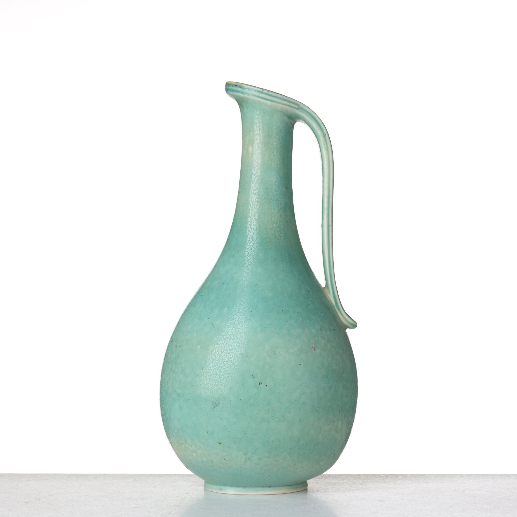 Gunnar Nylund, a stoneware ewer, Rörstrand, and a vase by unknown designer, mid 20th century.