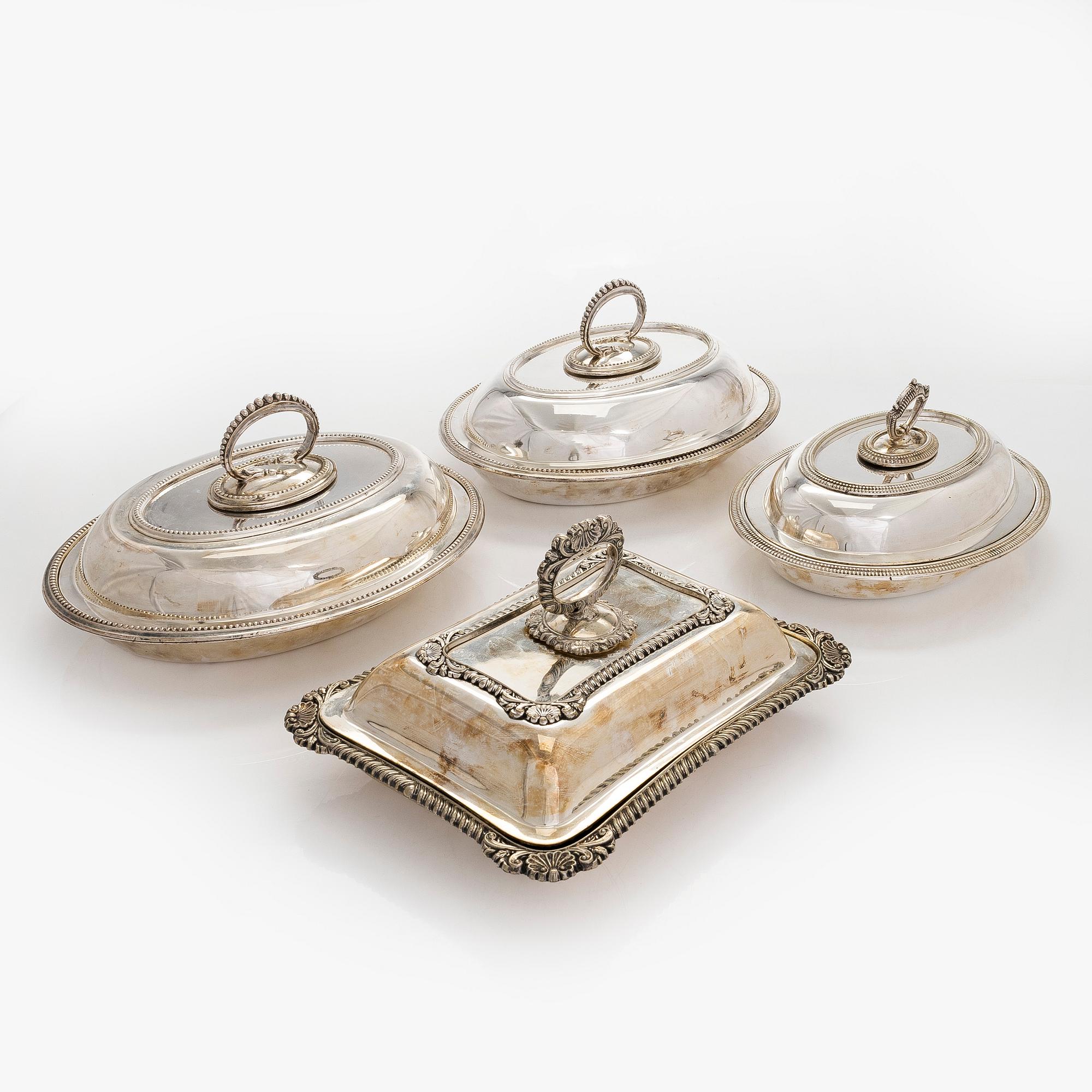 A set of four silver plated entree dishes, England.