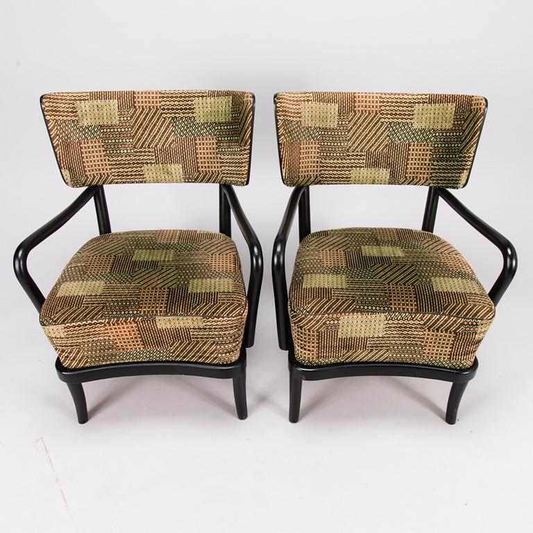 A mid-20th Century pair of armchairs.