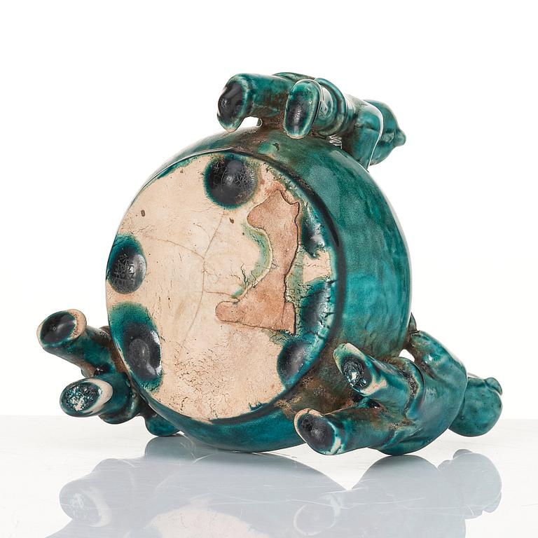 A turquoise glazed vessel supported by a group of boys, Qing dynasty, Kangxi (1662-1722).