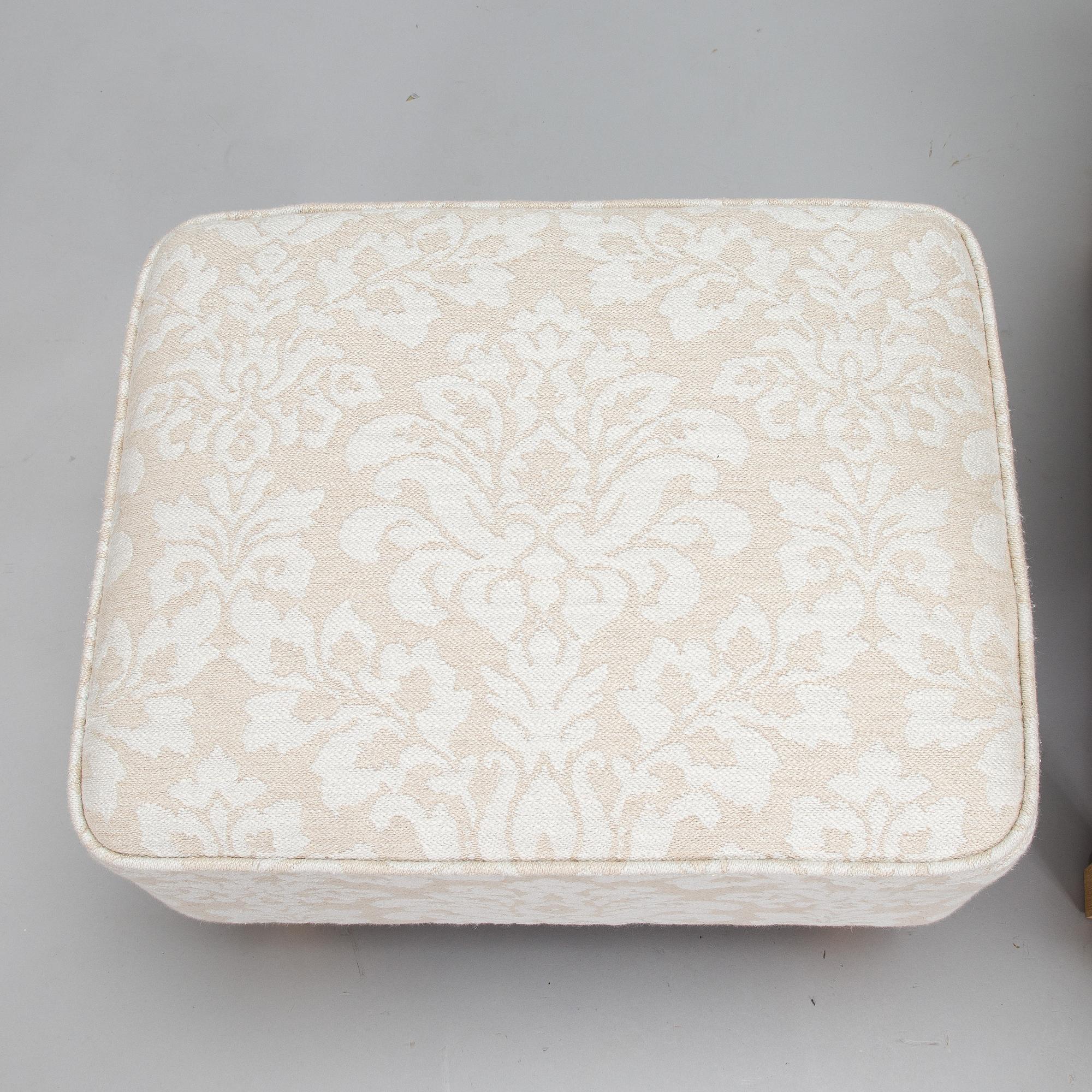 A mid-20th-century armchair and ottoman.