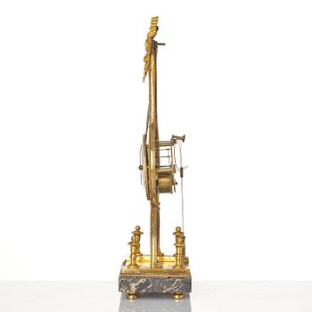 A French Louis XVI ormolu and marble lyre-shaped mantel clock, late 18th century.