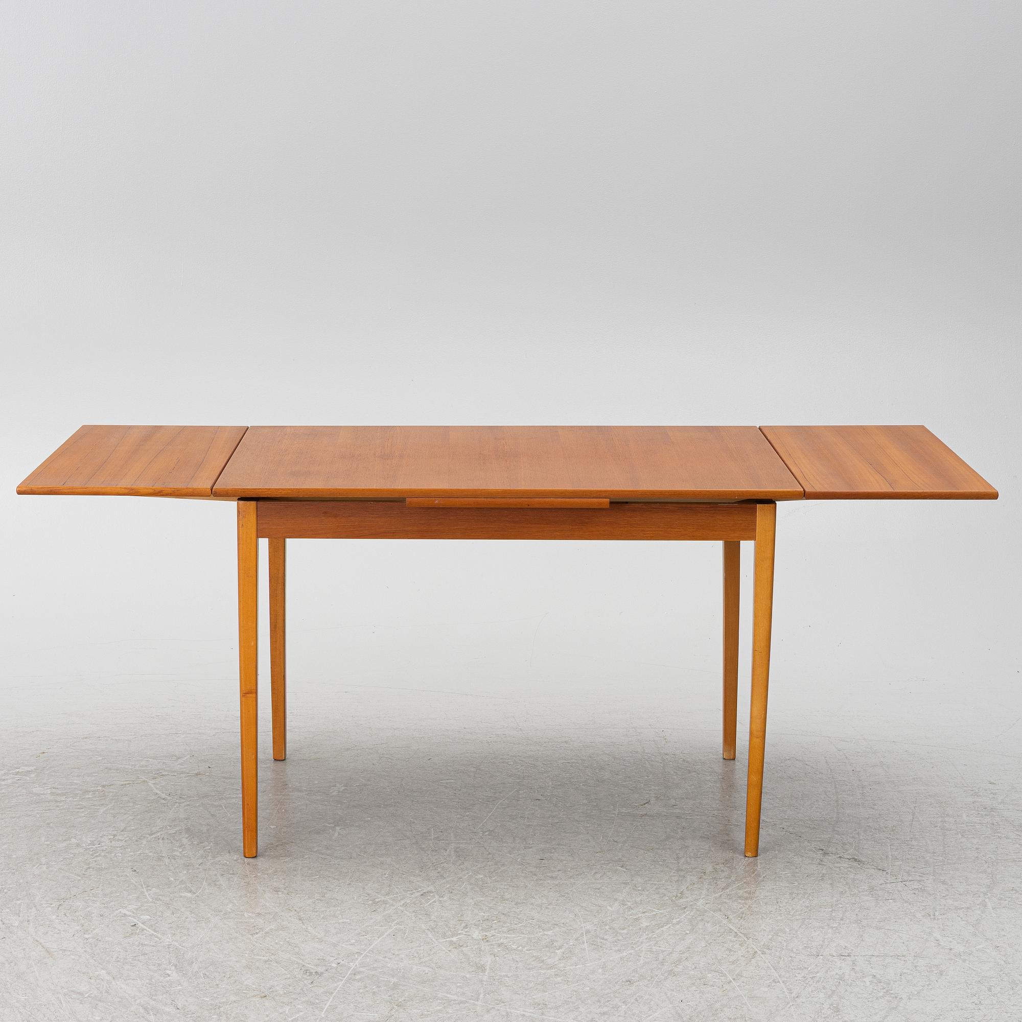 A mid20th century dining table.