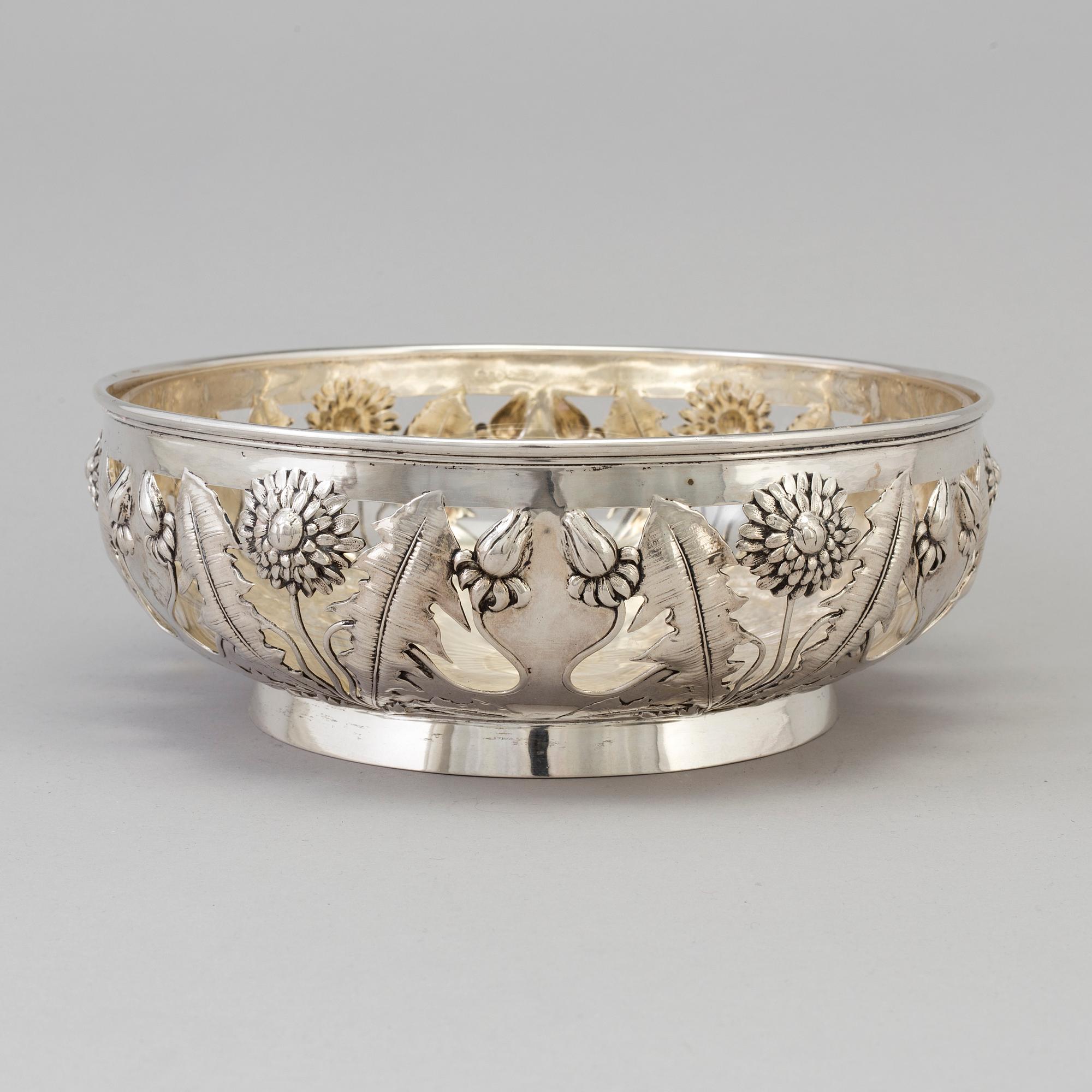 A Swedish Art Nouveau silver bowl with glass insert, decorated with dandelion, maker's mark K Anderson Stockholm 1906.
