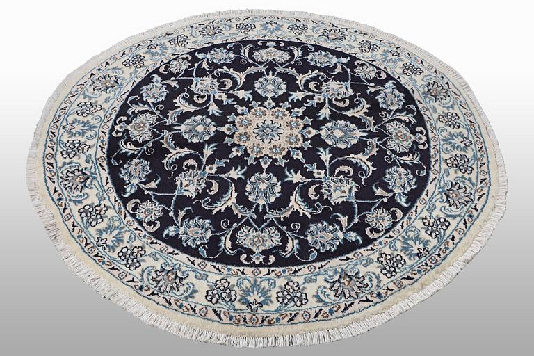 A rug, Nain, part silk, ca 140 x 140 cm.
