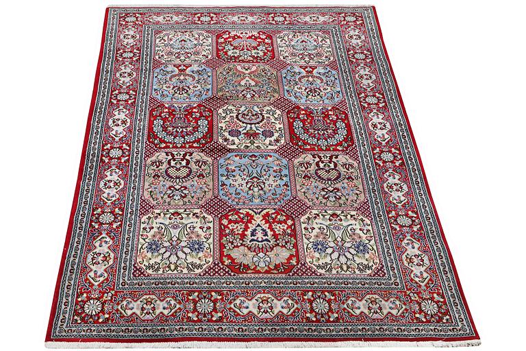 A Ghom rug, c. 250 x 150 cm.