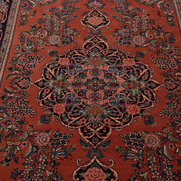 A semi.antique Kashan, around 198 x 133 cm.