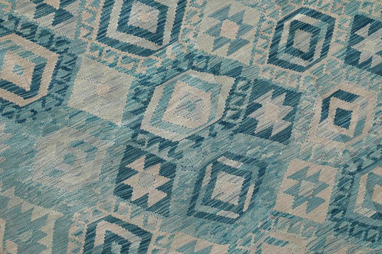 A Kelim carpet, 292 x 252 cm.