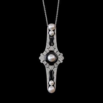 A PENDANT / BROOCH, brilliant cut diamonds c. 0.90 ct. Onyx. 18K white gold. Weight 12 g.