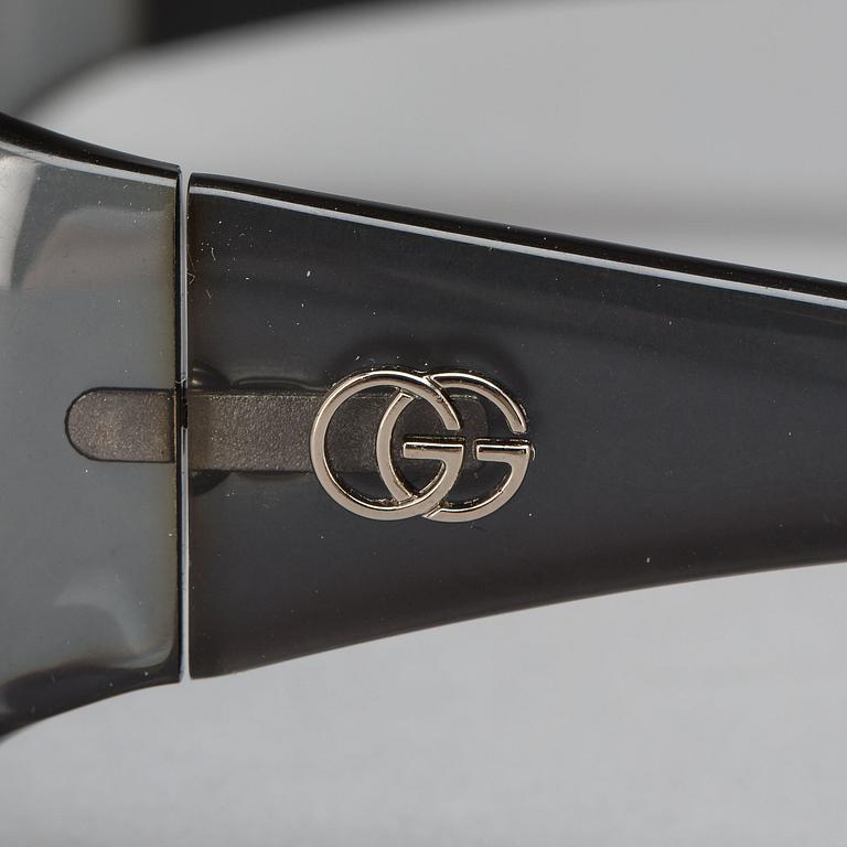 AURINKOLASIT, Gucci.
