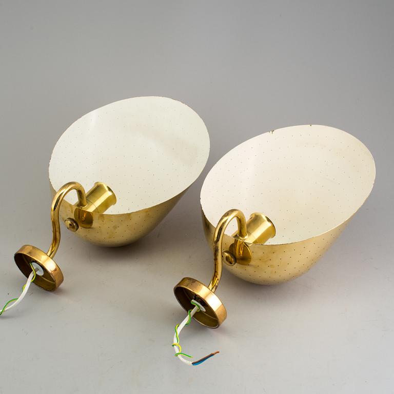 CARL-AXEL ACKING, a pair of brass wall lights.