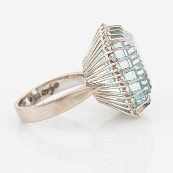 An 18K white gold Engelbert ring set with a aquamarine and round brilliant-cut diamonds.