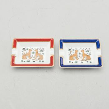 HERMÈS, a pair of porcelain ashtrays.