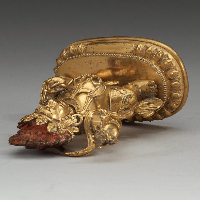 A Sinotibetan gilt bronze figure of a Dharmapala, Qing dynasty, presumably 18th Century.