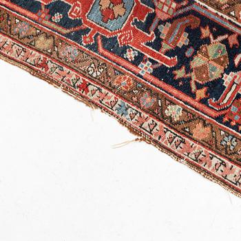 A antique Heriz carpet, ca 384 x 275 - 290 cm.