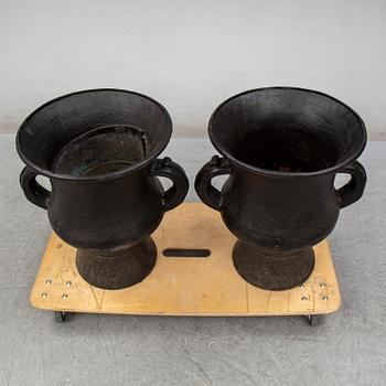 A pair of cast iron garden vases, 20th Century.