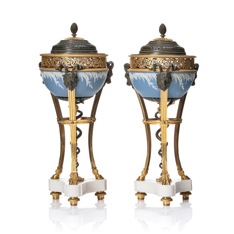 A pair of gilt bronze, marble and ceramic potpourri urns with covers, 19th century.