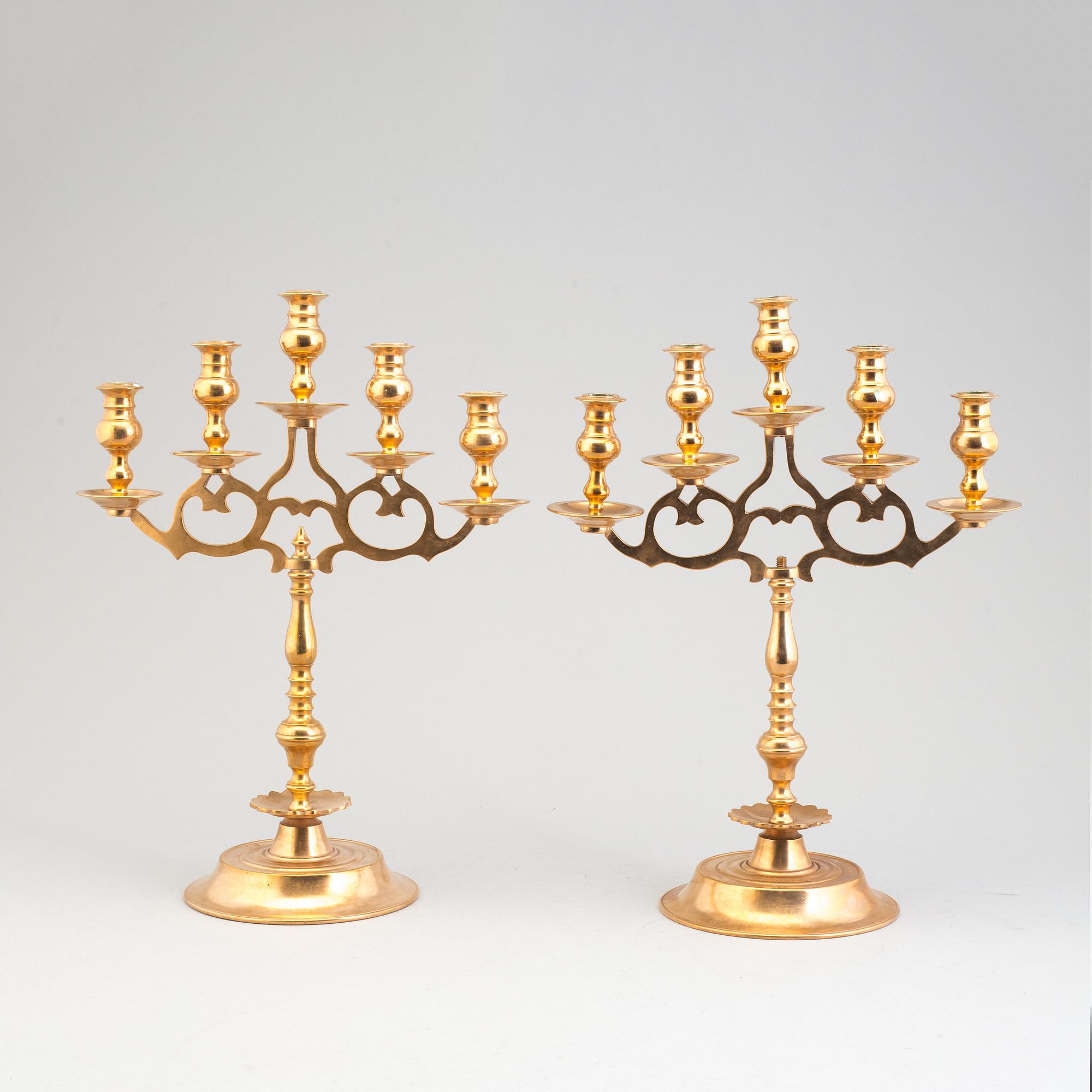 A pair of brass baroque style candelabra, early 20th century.