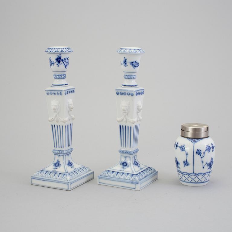 A pair of porcelain candlesticks and a lighter from Royal Copenhagen, Denmark.