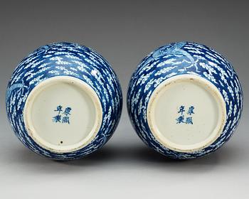 A pair of blue and white vases, late Qing dynasty, with Kangxi four character mark.