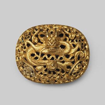 A gilt brass belt buckle, Qing dynasty, 19th Century.