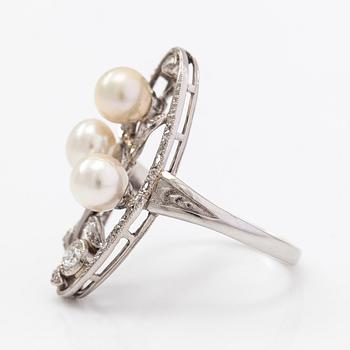 A platinum ring with old- and rose-cut diamonds and cultured pearls.